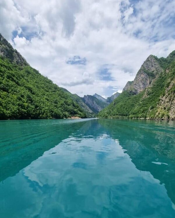 view from a boat of komani lake