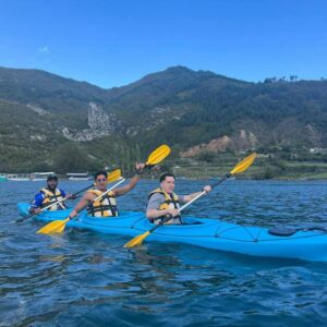 people kayaking in komani lake