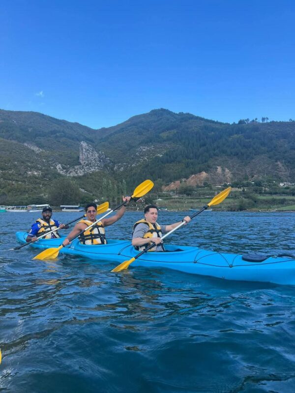 people kayaking in komani lake